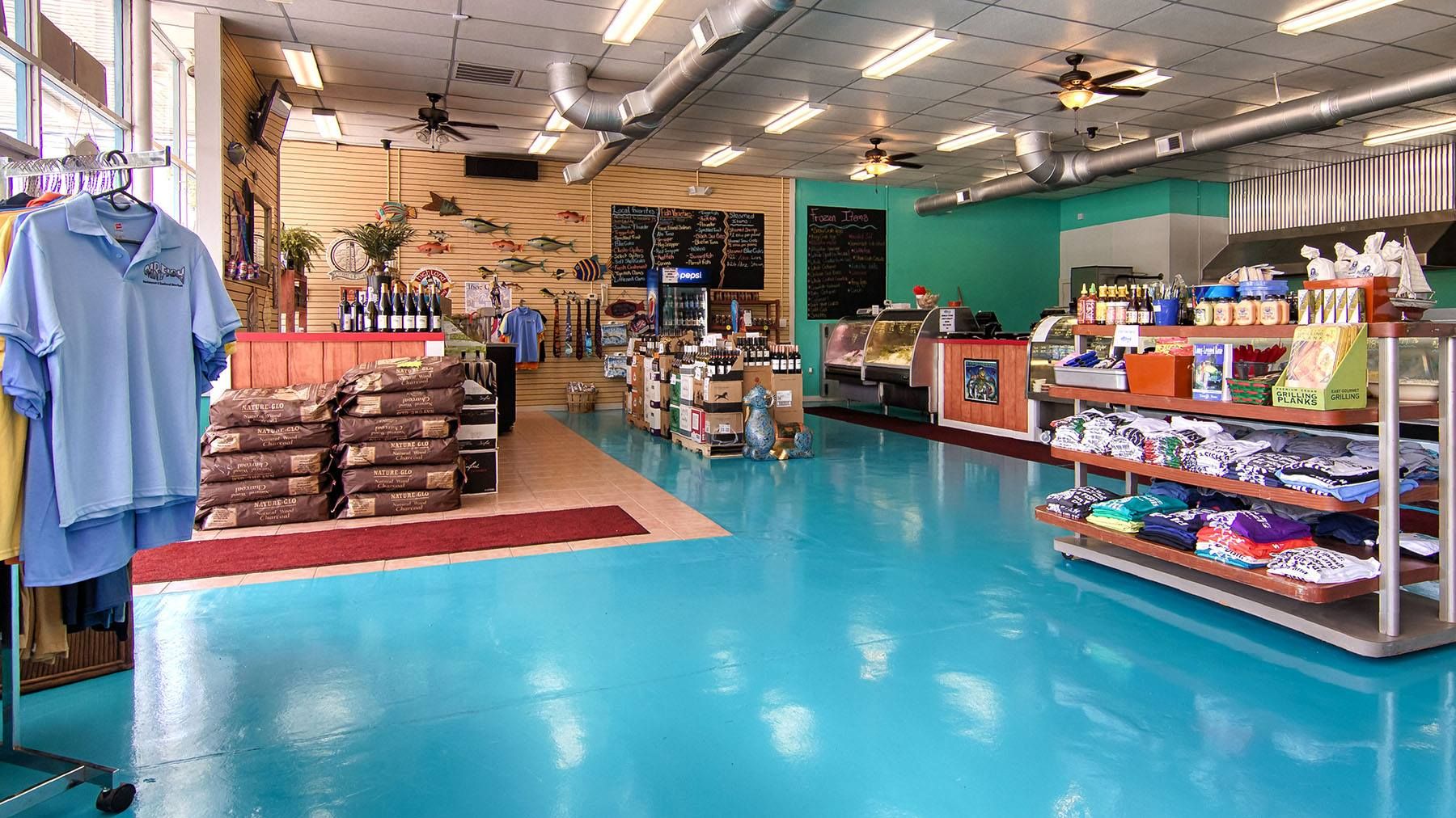 Mr. Fish Seafood Market & Grill, shelves are filled with fresh seafood, local goods, and coastal gifts in a bright market space. This Myrtle Beach seafood market is known for fresh catches, prepared foods, and unique items that visitors can take home.