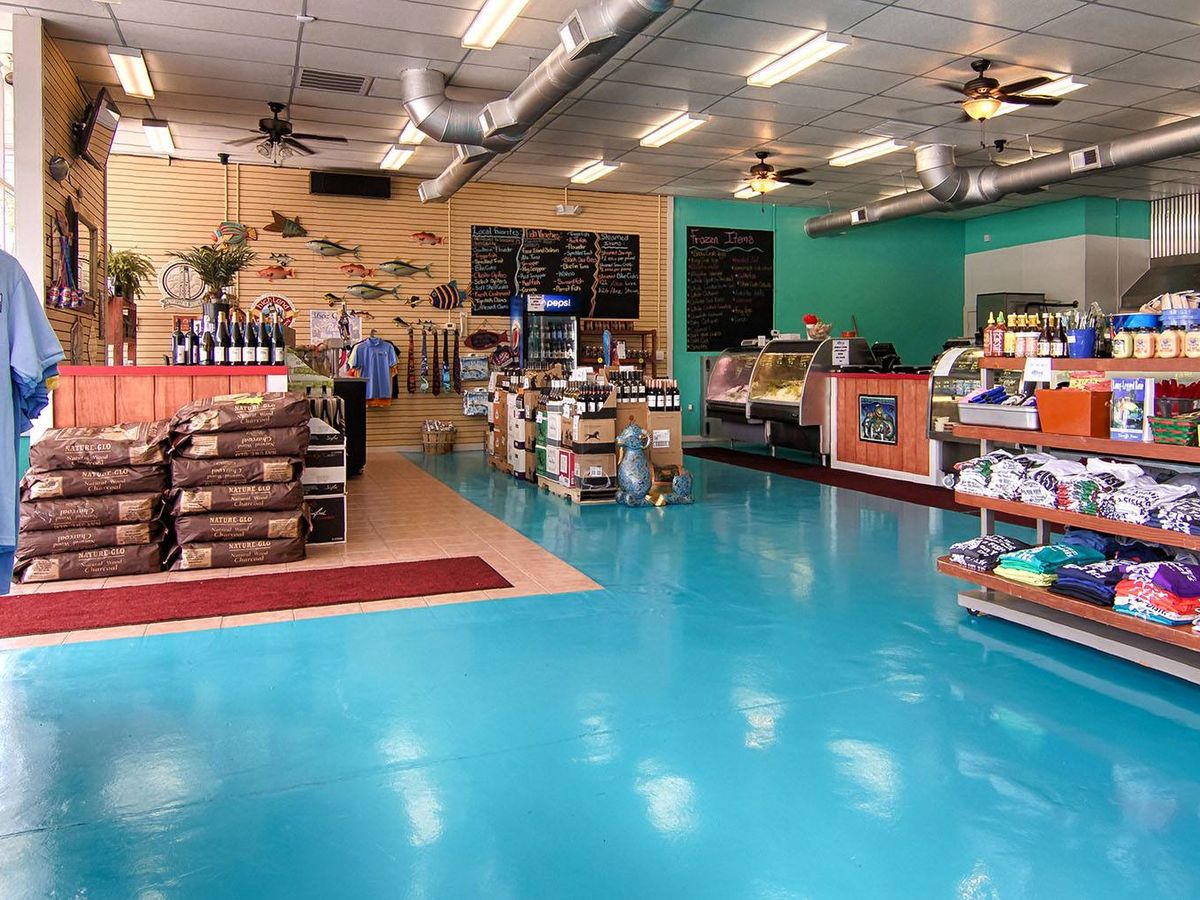 Mr. Fish Seafood Market & Grill, shelves are filled with fresh seafood, local goods, and coastal gifts in a bright market space. This Myrtle Beach seafood market is known for fresh catches, prepared foods, and unique items that visitors can take home.