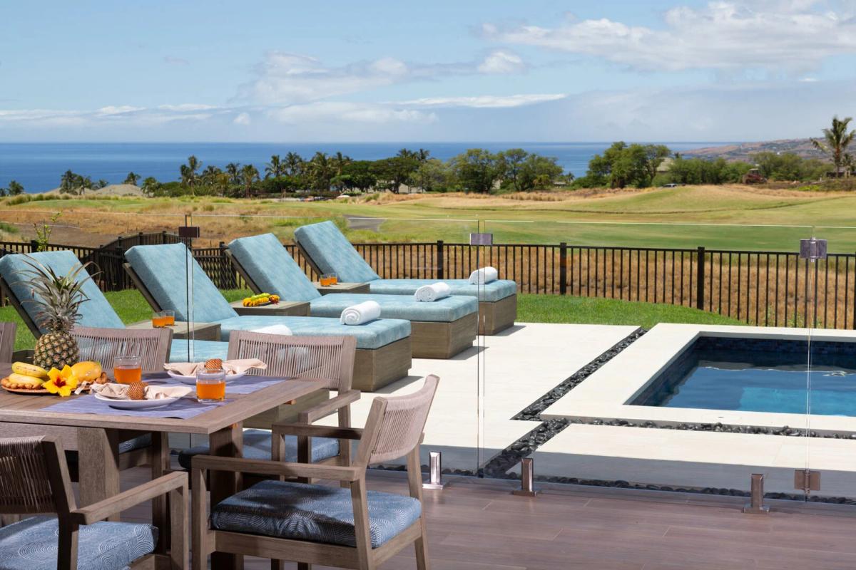 View of the pool with outdoor seating.