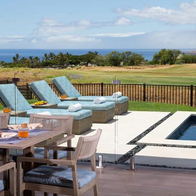 View of the pool with outdoor seating.