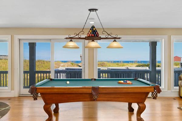 Pool table with water view in a luxury Outer Banks vacation rental