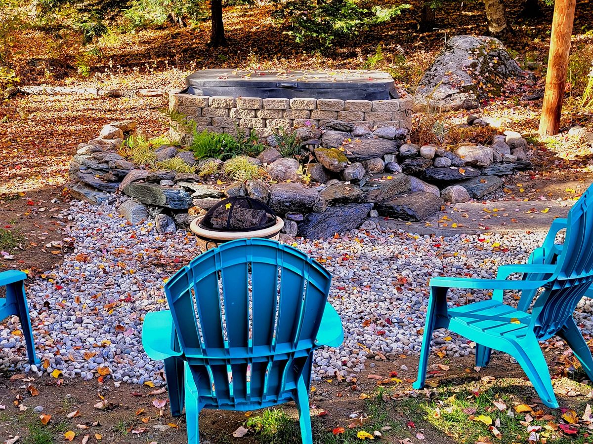 Hot Tub Surrounded by Forrest At A Luxury Killington Vacation Rental