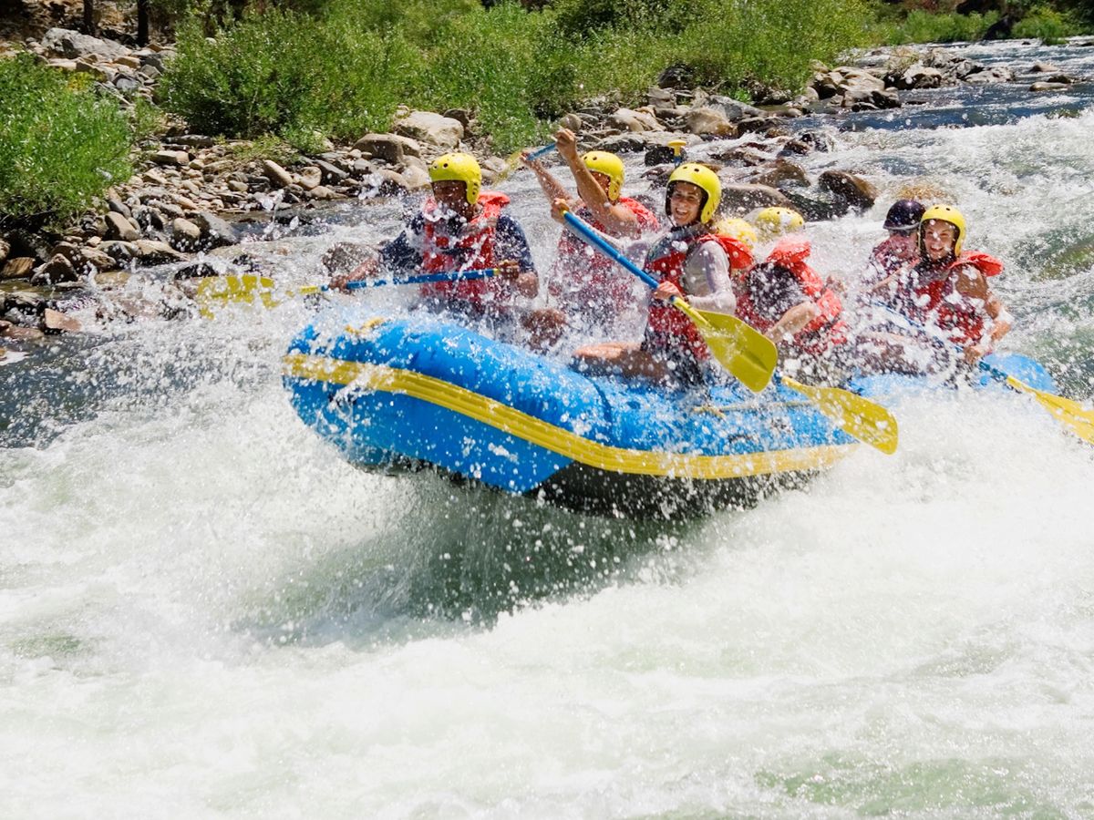 Family On A Blue Raft Whitewater Rafting The Eagle River