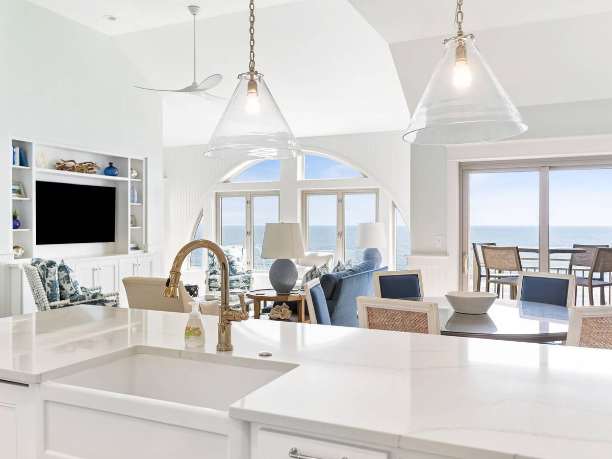 A stylish villa featuring elegant interiors, plush seating, and a fully equipped kitchen. Large windows and private balconies showcase sweeping views of the beach and ocean. This villa provides the ideal mix of luxury and laid-back comfort.