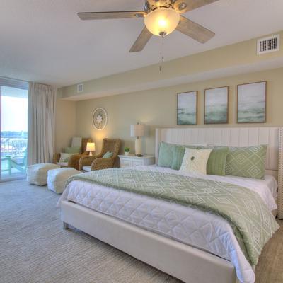 Primary bedroom with views of the Intracoastal Waterway in a Myrtle Beach vacation rental.