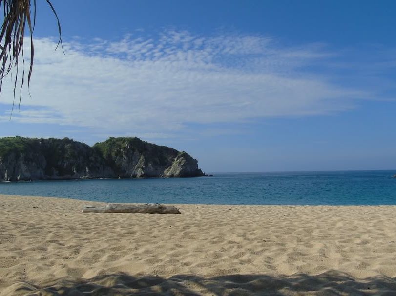 Bahia de Cacaluta in Huatulco is a hidden paradise with turquoise waters and untouched sandy beaches. Surrounded by lush hills, it’s the perfect escape for travelers seeking peace and natural beauty.