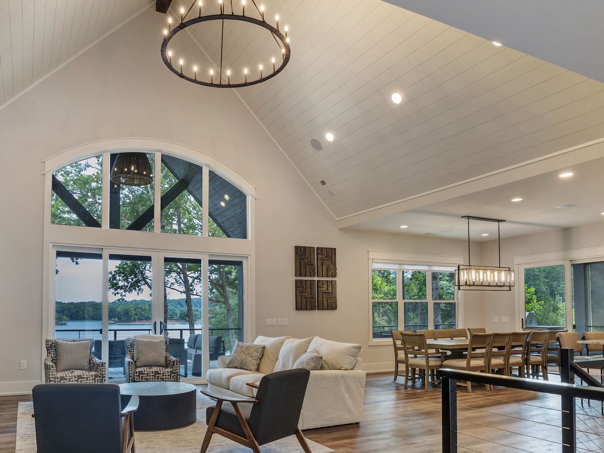 Luxury Clemson Vacation Rental Living Room With Beautiful Lighting Overlooking Lake