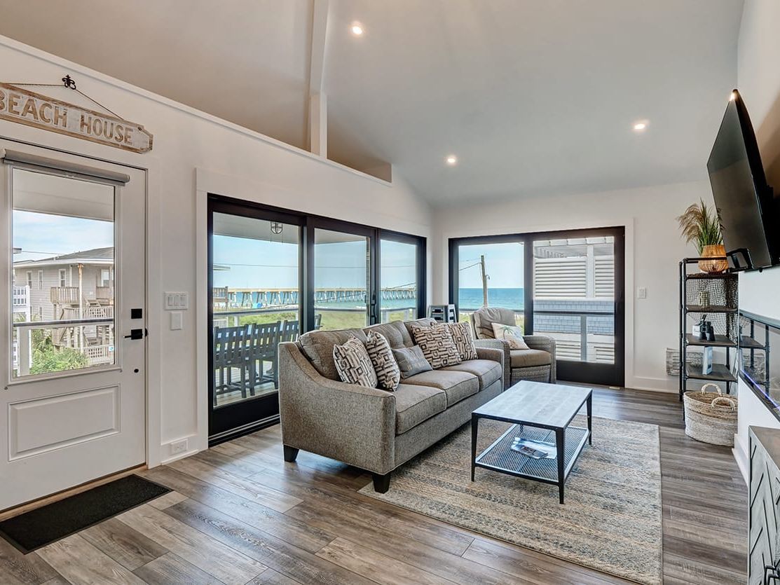Spacious oceanfront rental with sweeping views of the beach and pier, designed for large families and groups. With multiple balconies and cozy interiors, it offers both relaxation and entertainment steps from the sand.