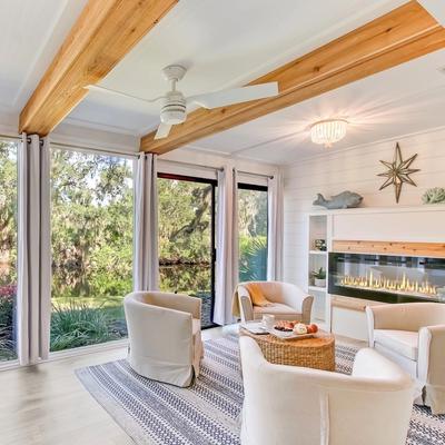Living Room With Fireplace and Lush landscape Views in Luxury Amelia Island Vacation Rental