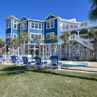 Exterior view of a Holden Beach vacation rental with a private pool.