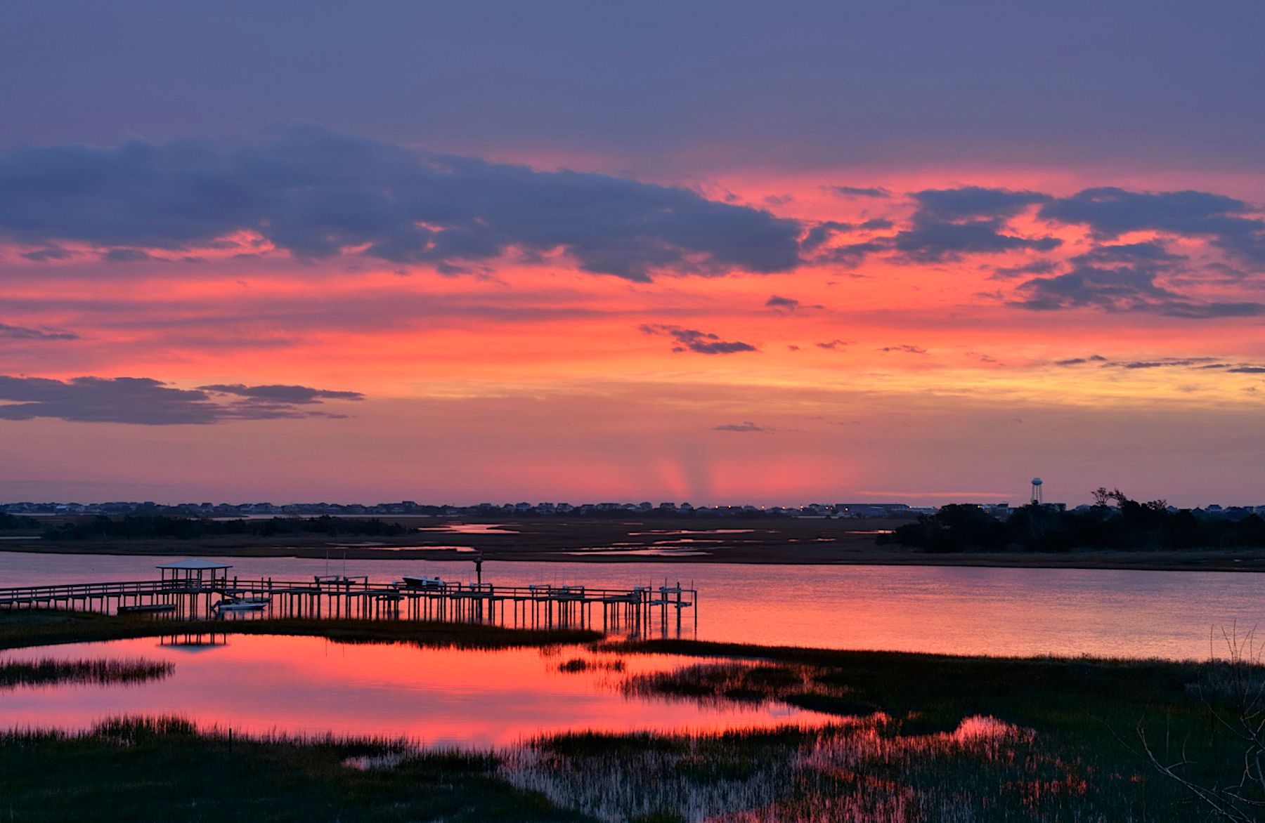 Sunrise over pier and Intercoastal Waterway on Topsail Island North Carolina