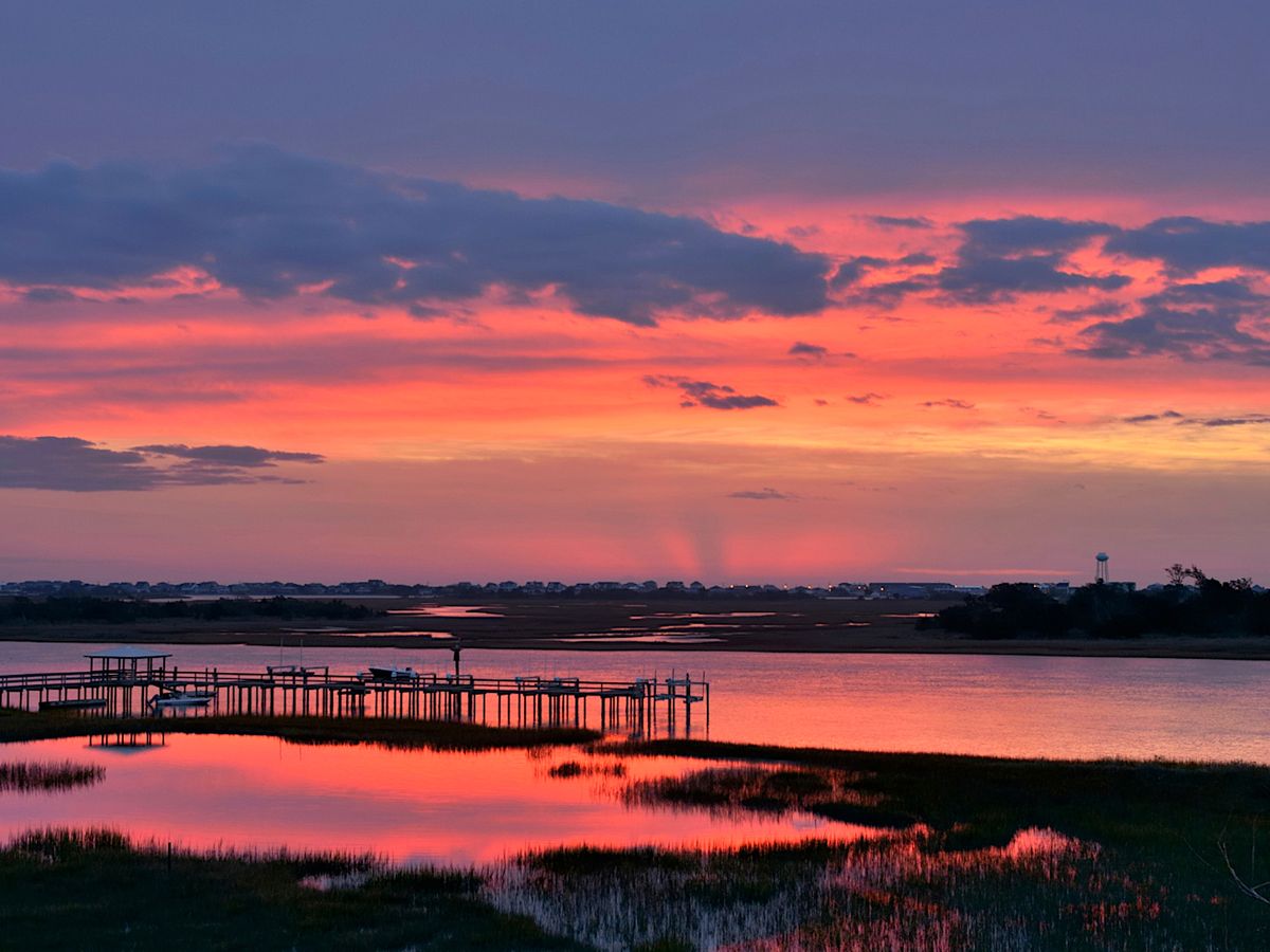 Sunrise over pier and Intercoastal Waterway on Topsail Island North Carolina