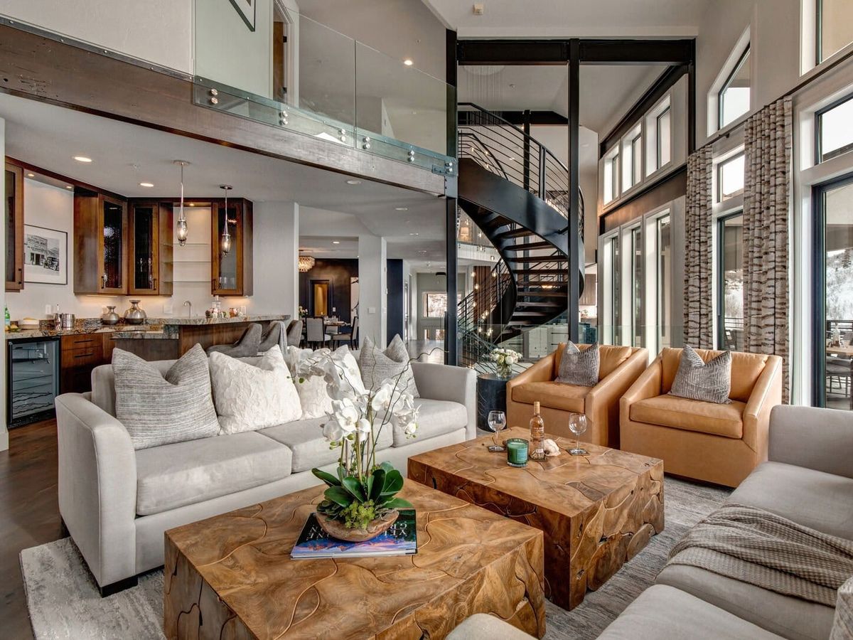 Abode at Aerie View in Park City features bold design, mountain views, and sleek furnishings. Guests can unwind in the hot tub or cook together in the chef’s kitchen.