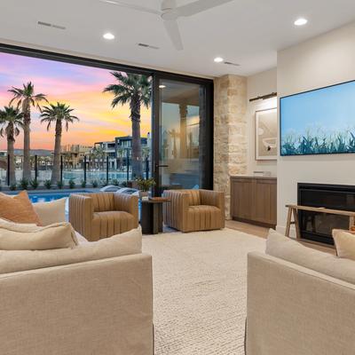Living room overlooking the outdoor living space at Lagoon Life Beach House.