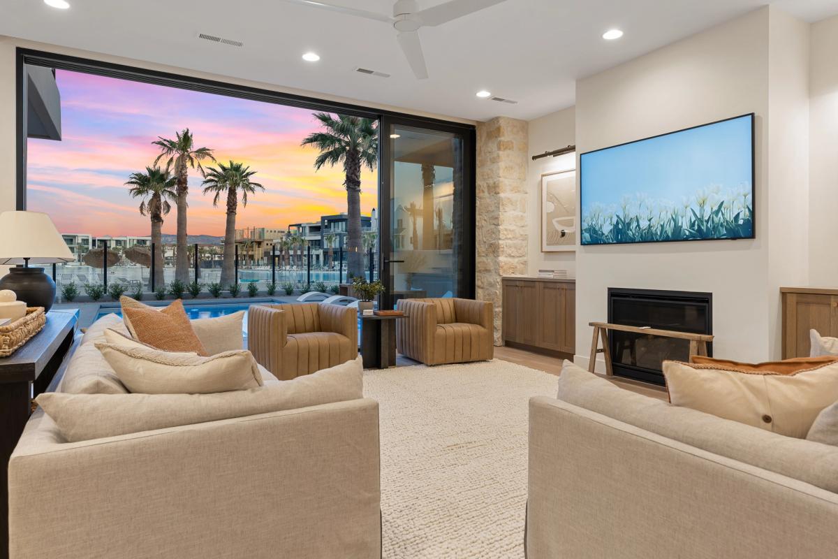 Living room overlooking the outdoor living space at Lagoon Life Beach House.