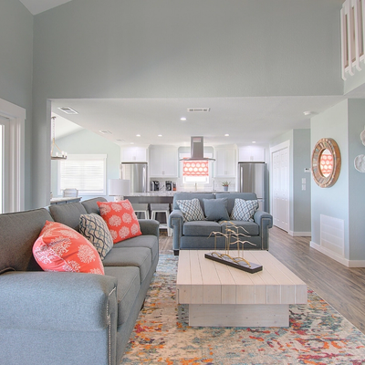 Living room and kitchen in Sorrento, an oceanfront vacation rental in Ocean Isle Beach.