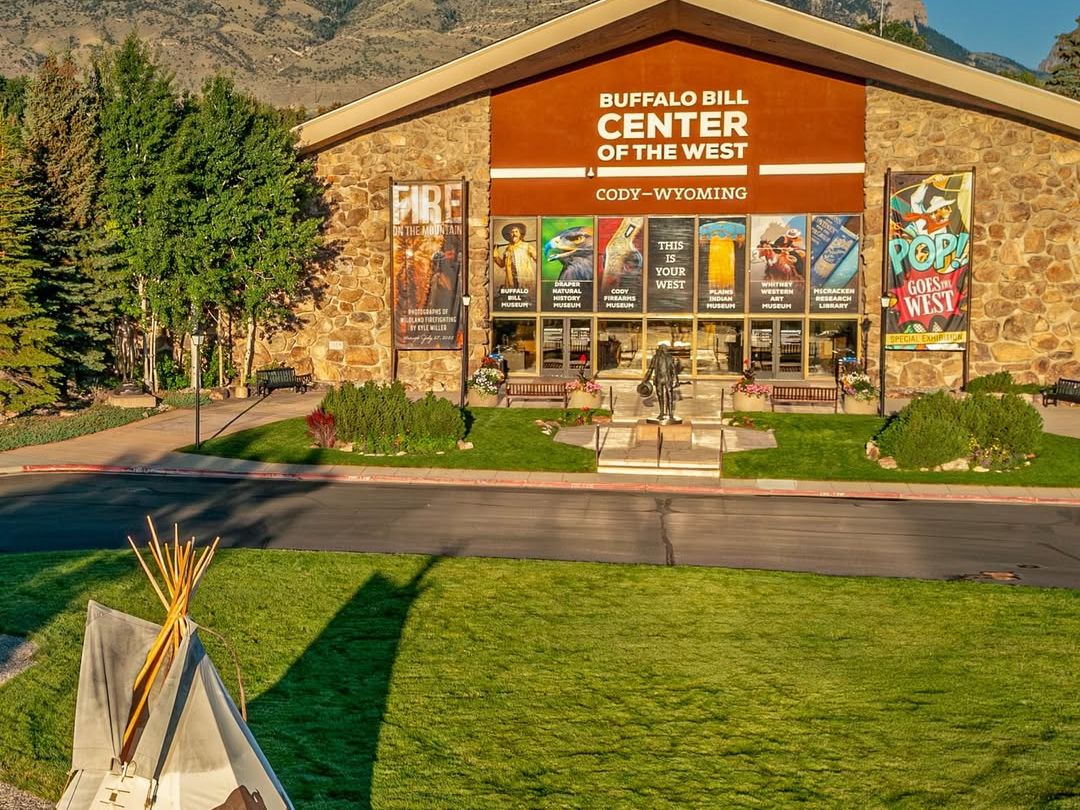 he Buffalo Bill Center of the West in Cody, Wyoming, highlights Western heritage with multiple museums, exhibits, and a striking entrance surrounded by mountain views.