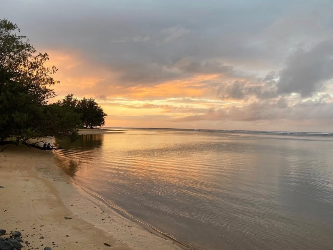 Sunset going down at beach in Hawaii