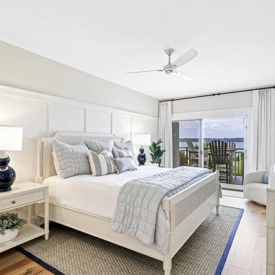Primary bedroom in 1888 Beachside Tennis Villa.