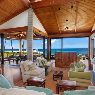 Living room wide large open windows to oceanfront view