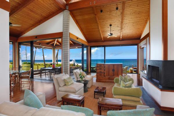 Living room wide large open windows to oceanfront view