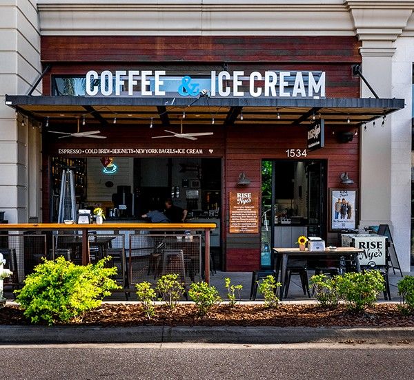 he Rise Coffee storefront invites you in with its cozy patio, bold signage, and relaxed neighborhood feel. It’s a great stop for fresh coffee, ice cream, and an easy morning hangout in Sarasota.