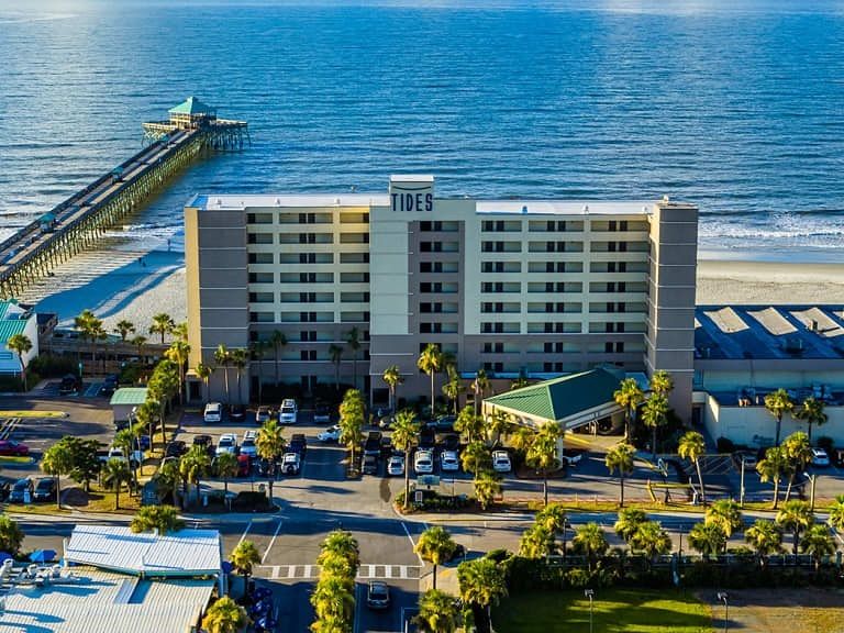 The Tides Folly Beach Hotel sits right on the sand, offering oceanfront rooms, a poolside view, and direct access to the famous pier.