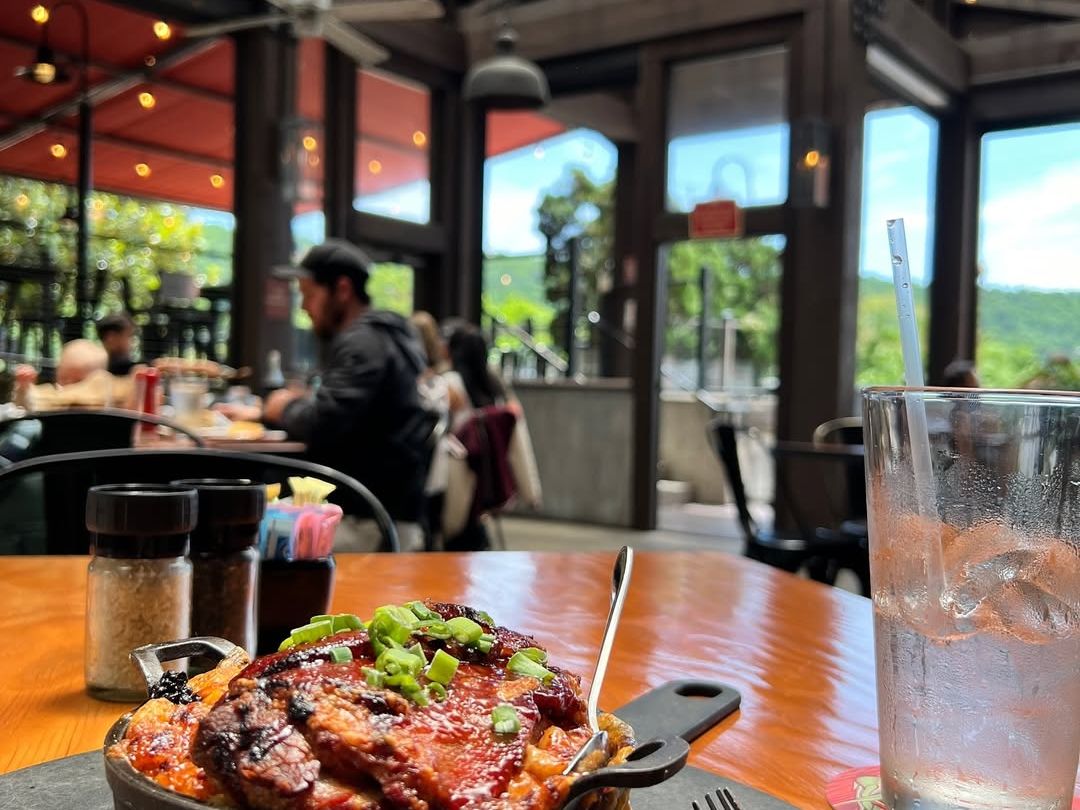 Casual charm at Pack’s Tavern, serving hearty meals, craft beers, and comfort favorites in a historic downtown Asheville setting with lively energy.