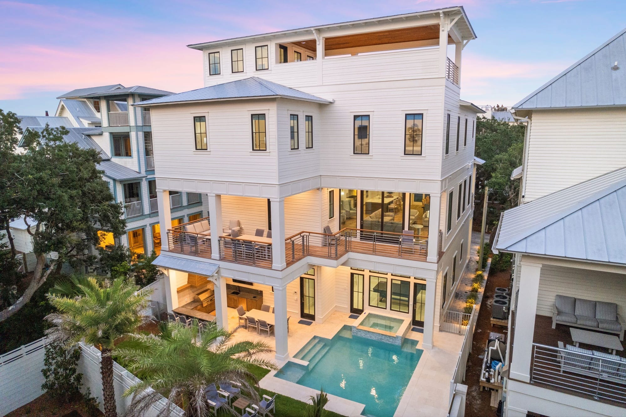 A grand coastal home on Florida’s Emerald Coast featuring multiple balconies, open living spaces, and a private pool. Designed for large groups, it’s a serene yet luxurious seaside escape.