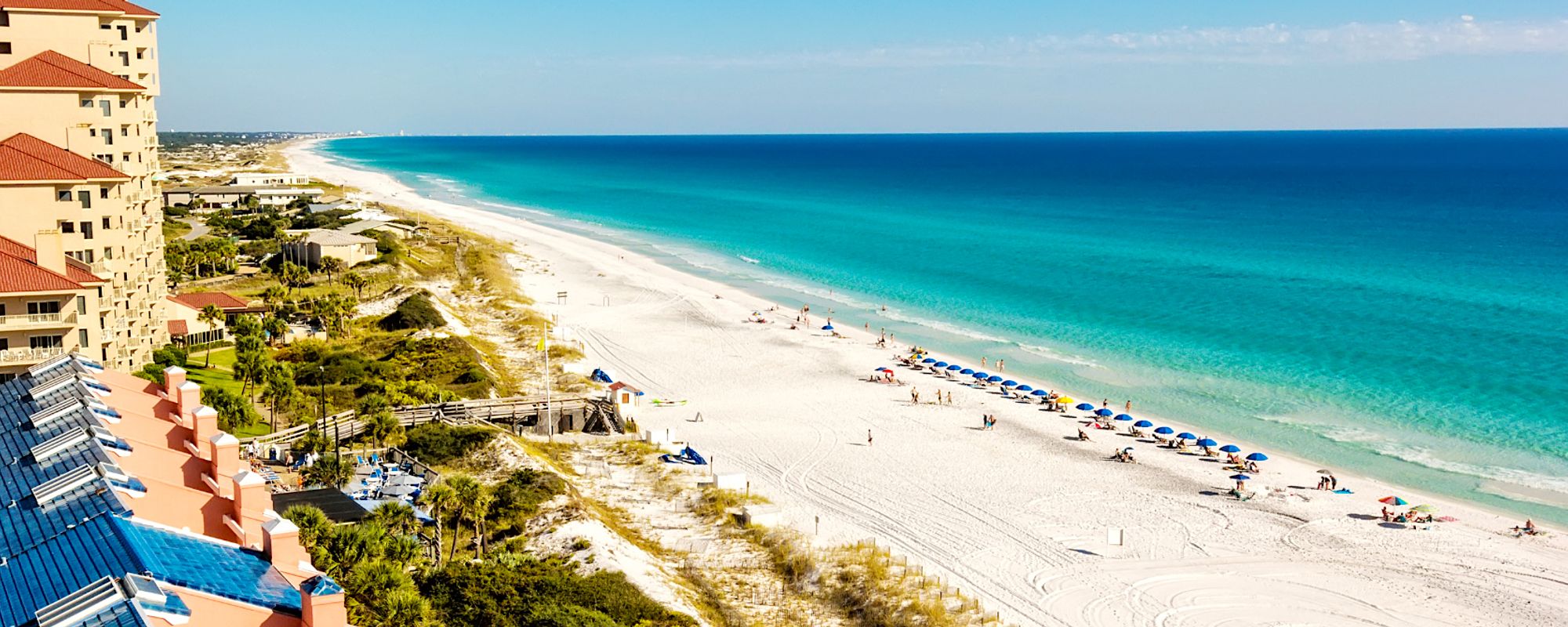 Aerial View of Destin Condos and Beach with Chairs