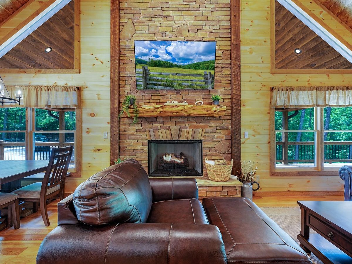 Screened-in porch with cozy outdoor seating and picture-perfect mountain views. This smaller cabin has everything you need for a peaceful weekend away, including nature visits from deer and wild turkeys.