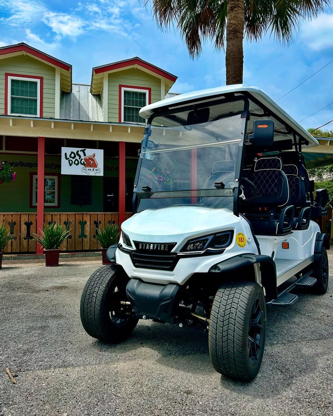 A white golf cart parked outside Lost Dog Café, a popular breakfast and lunch spot on Folly Beach. The café’s bright exterior and casual vibe match the island lifestyle. It’s a favorite stop for locals and visitors grabbing a quick bite.