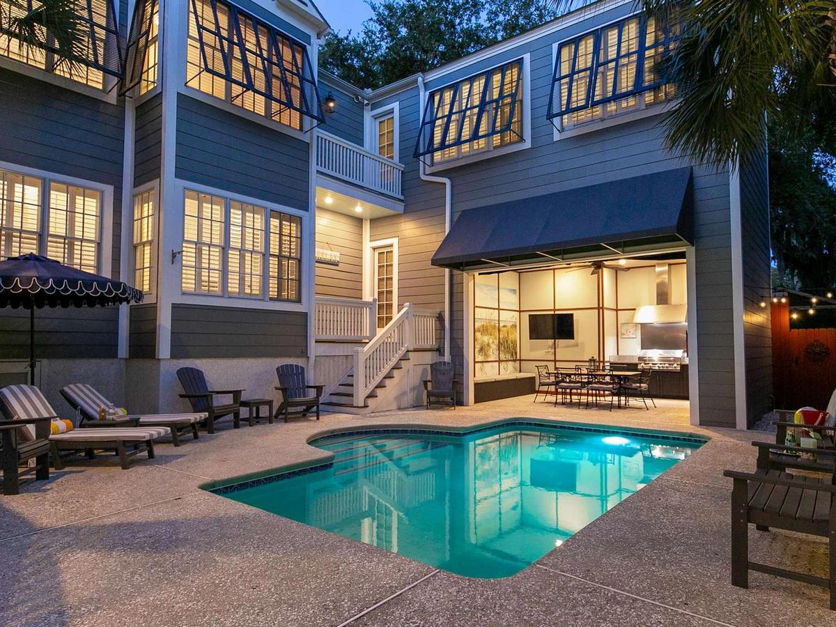 Backyard with Private Pool and Lounge Chairs at Luxury St. Simons Island Vacation Rental