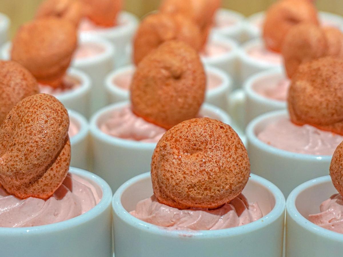 Dessert food with whipped bottom and orange crunchy top in ceramic small bowls in the Bahamas