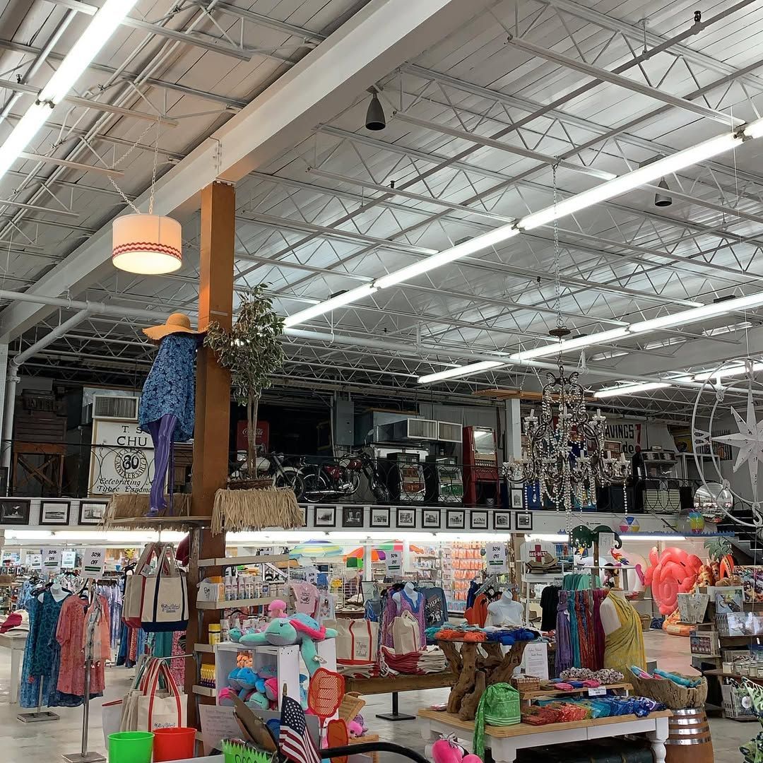 A local Tybee shop overflows with colorful beachwear, souvenirs, and playful displays. The vibrant shopping space invites visitors to browse and take home a piece of island life.