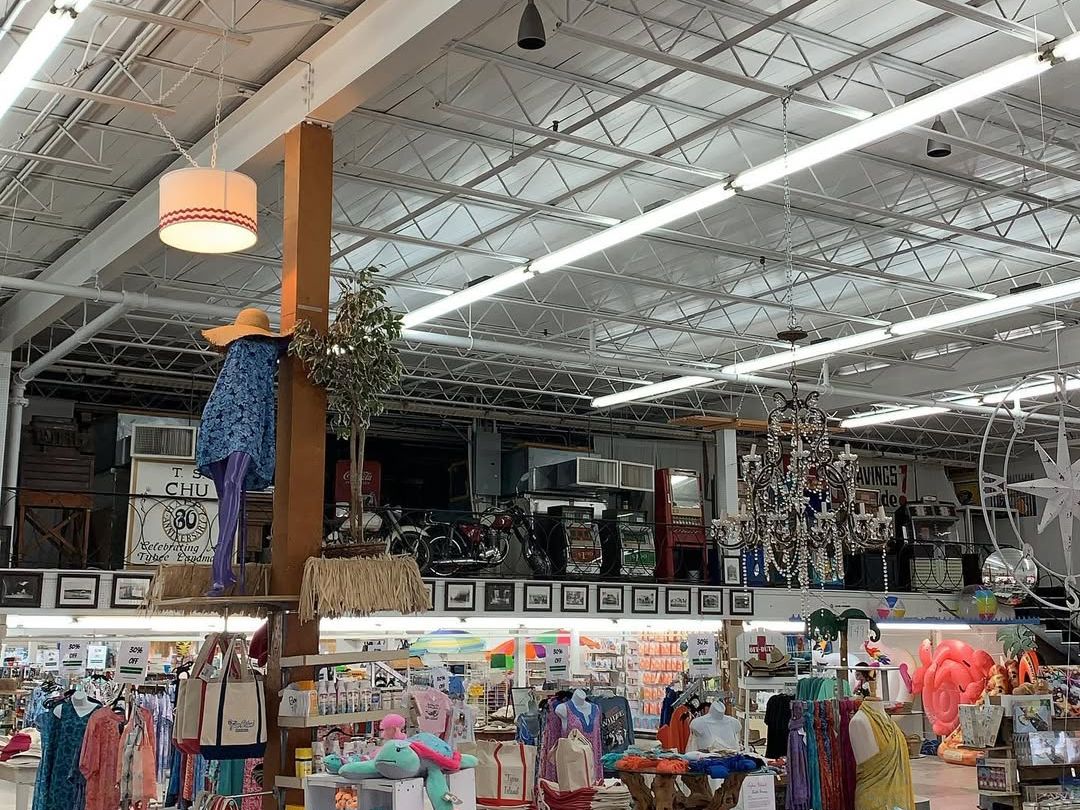 A local Tybee shop overflows with colorful beachwear, souvenirs, and playful displays. The vibrant shopping space invites visitors to browse and take home a piece of island life.