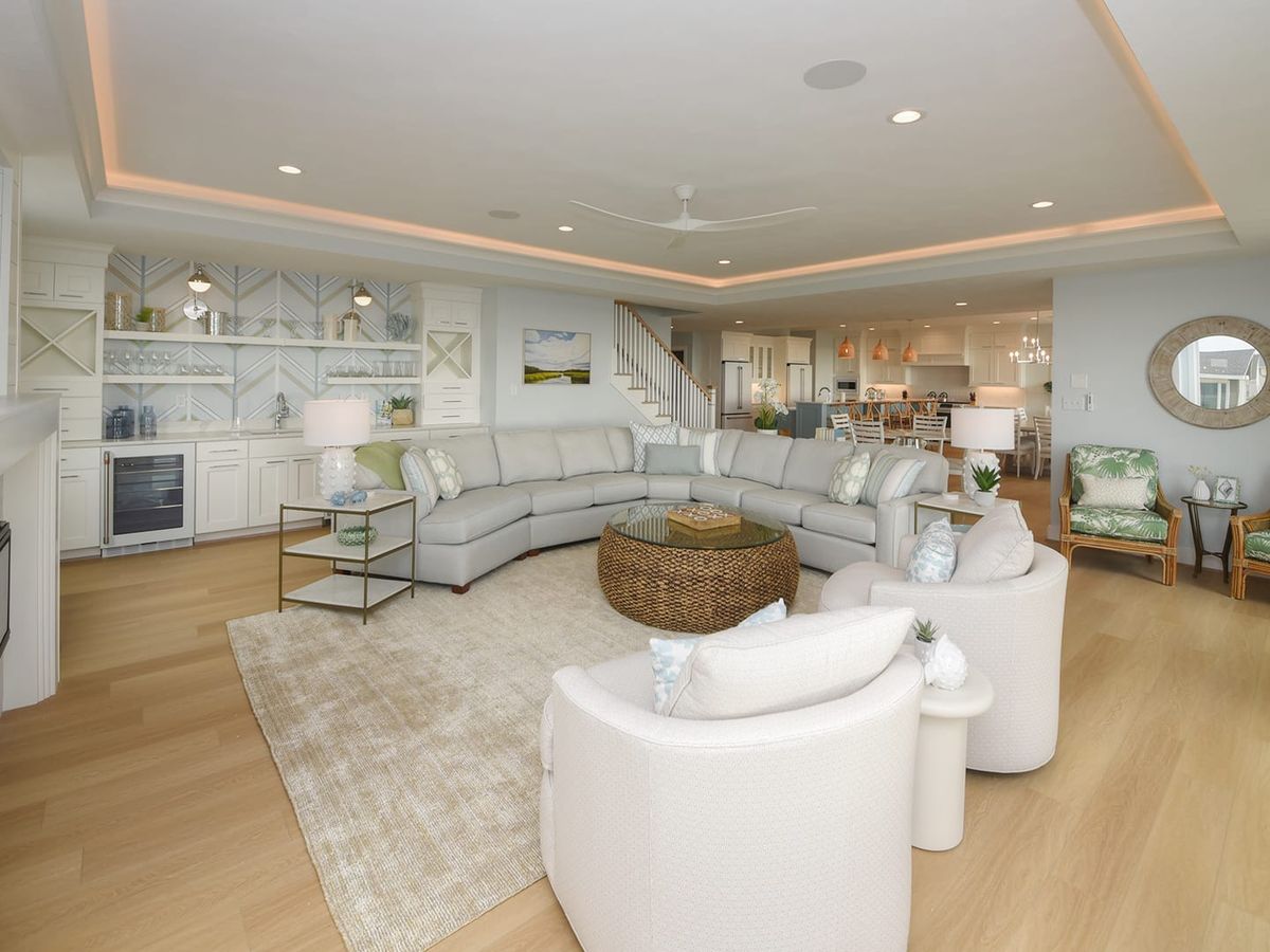 Spacious oceanfront vacation home with a private pool, sun loungers, and outdoor seating, perfect for large family gatherings or group getaways. Modern design and beach views create a relaxing coastal escape.