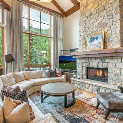 Living room with fireplace in a Vail vacation rental.