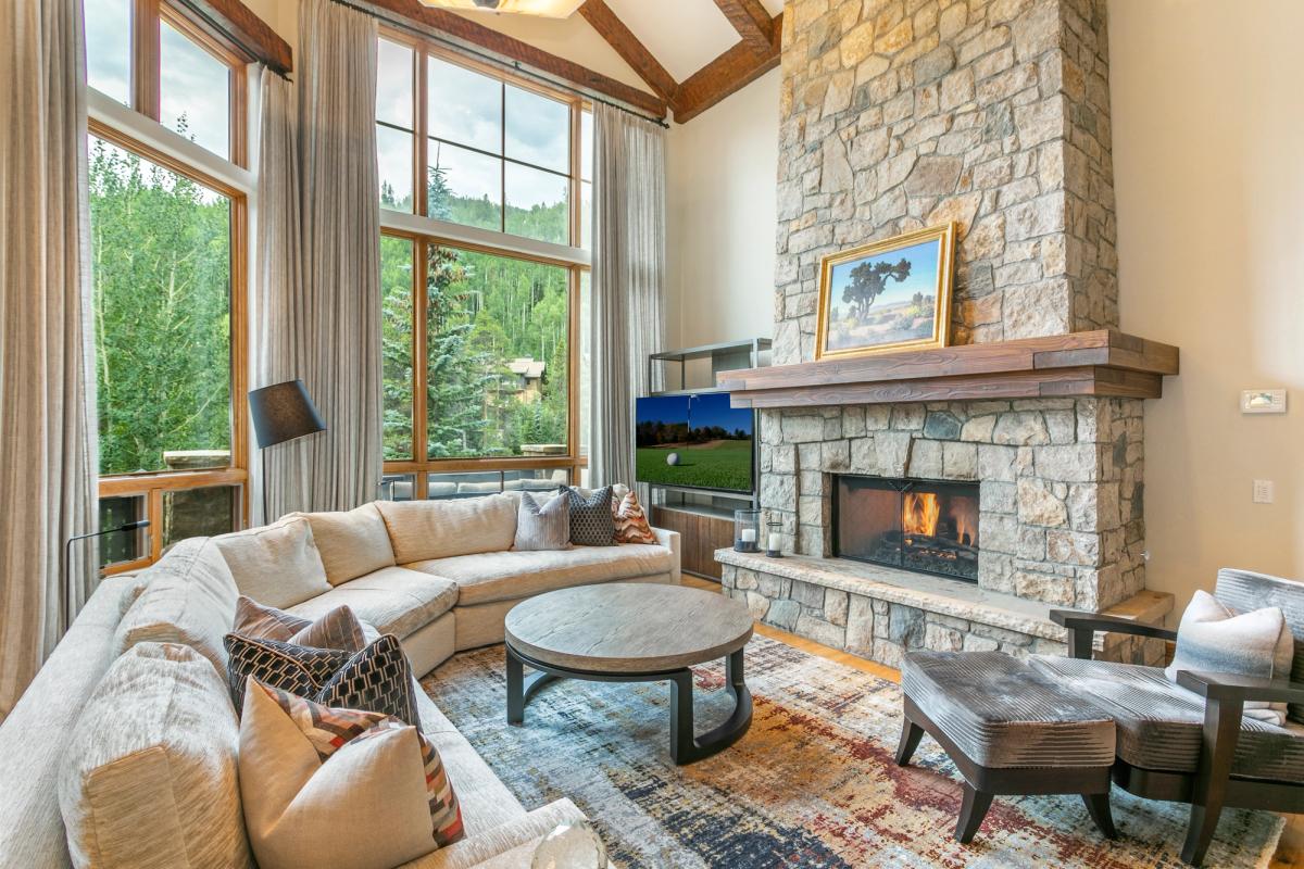 Living room with fireplace in a Vail vacation rental.