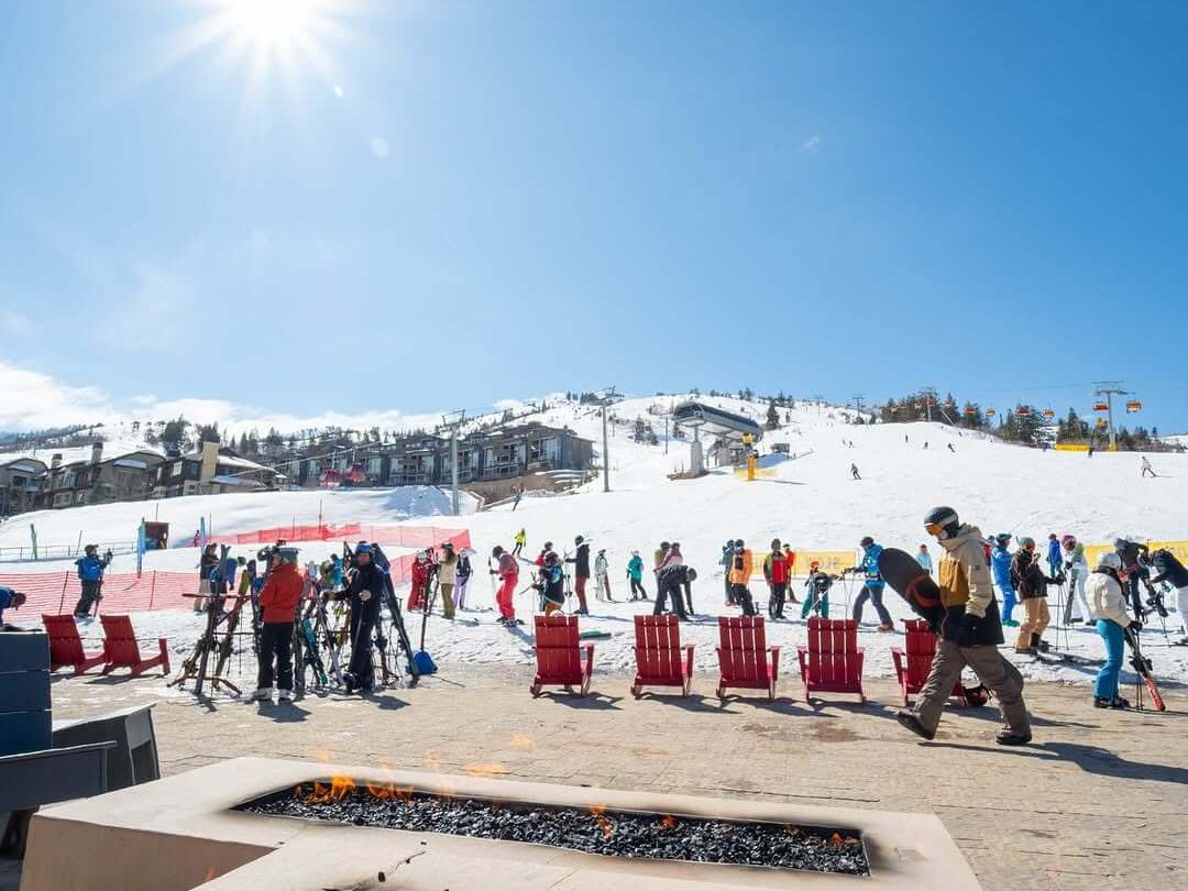 The sun is shining, the fire pits are glowing, and skiers are gearing up for another run. Park City Mountain feels alive with energy, cozy mountain vibes right at the base.