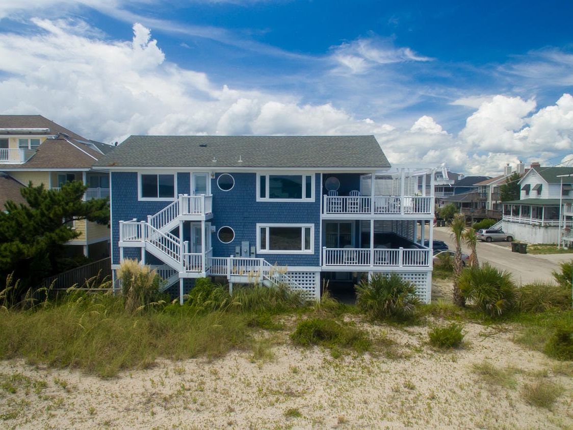 Located just steps from Wrightsville Beach, Sweet Carolina offers bikes, beach chairs, and a dog-friendly stay with room to relax. The open layout and three floors provide plenty of space for family fun and coastal breezes.
