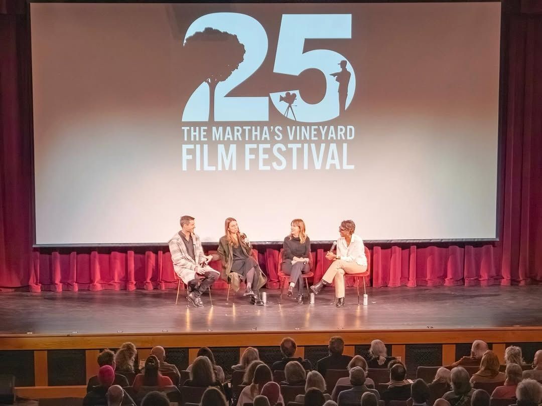 A panel of filmmakers and guests engage in a lively discussion during the 25th Martha’s Vineyard International Film Festival. The audience listens closely as stories and ideas unfold on stage, celebrating creativity and cinematic storytelling.