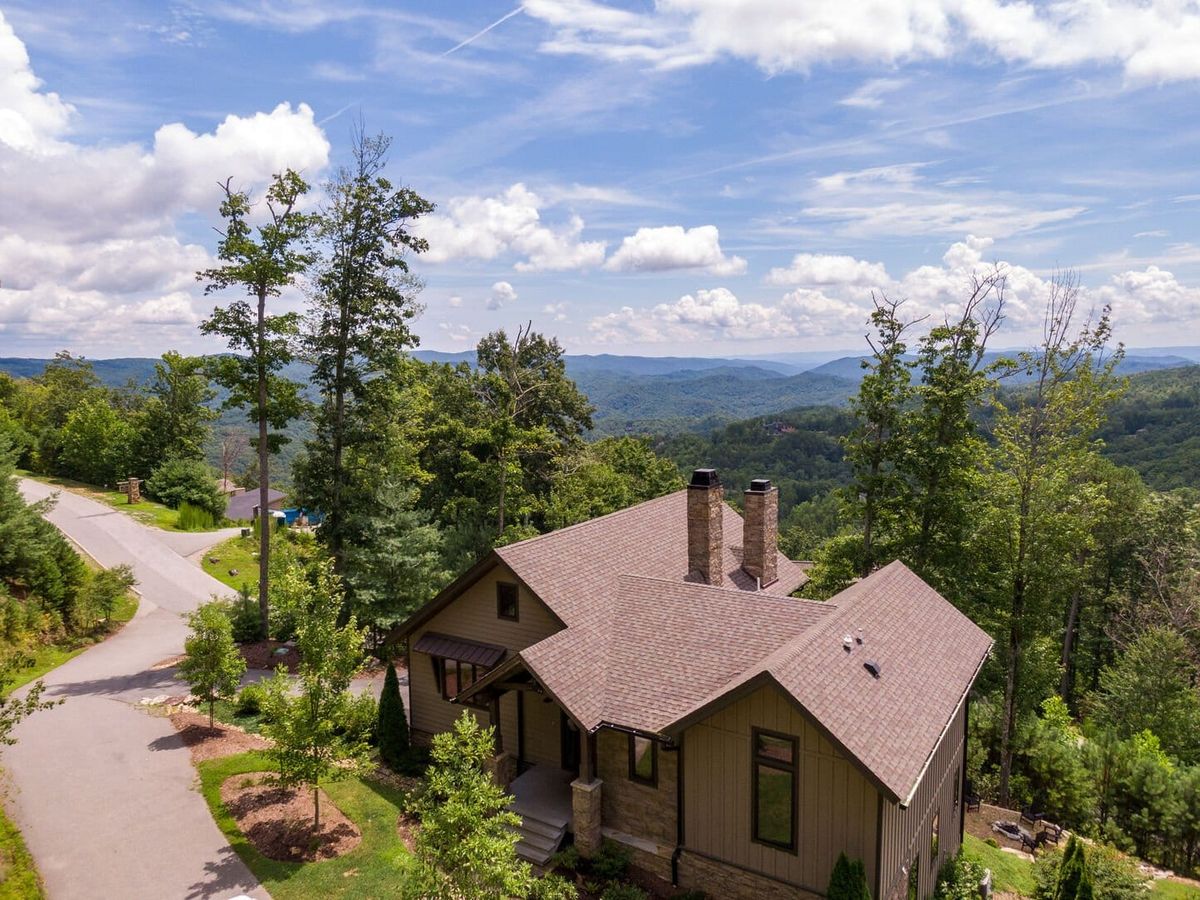 Tucked in the Boone, Blowing Rock, and Banner Elk region, this luxury mountain rental comes with a hot tub, Tesla charger, and private trails. Pets are welcome, and the views, firepit, and game room make it great for the whole crew.