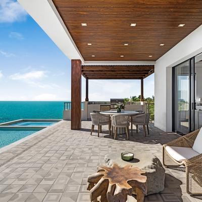 Outdoor living space overlooking the pool.