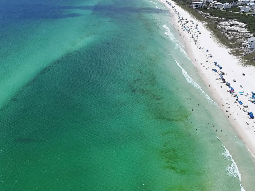 Seacrest Beach captures the beauty of emerald waters, long sandy shores, and vibrant beach umbrellas dotting the coastline. With family-friendly rentals and a relaxed vibe, it’s a must-visit on 30A.