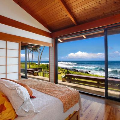 Cozy bed with vibrant orange bedding, wooden ceiling beams, and minimalist decor
