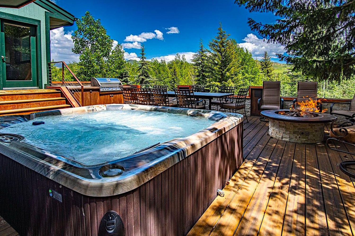 Hot tub, Fire Pit, and Outdoor Seating on Back Deck of Luxury Sun Valley Vacation Rental
