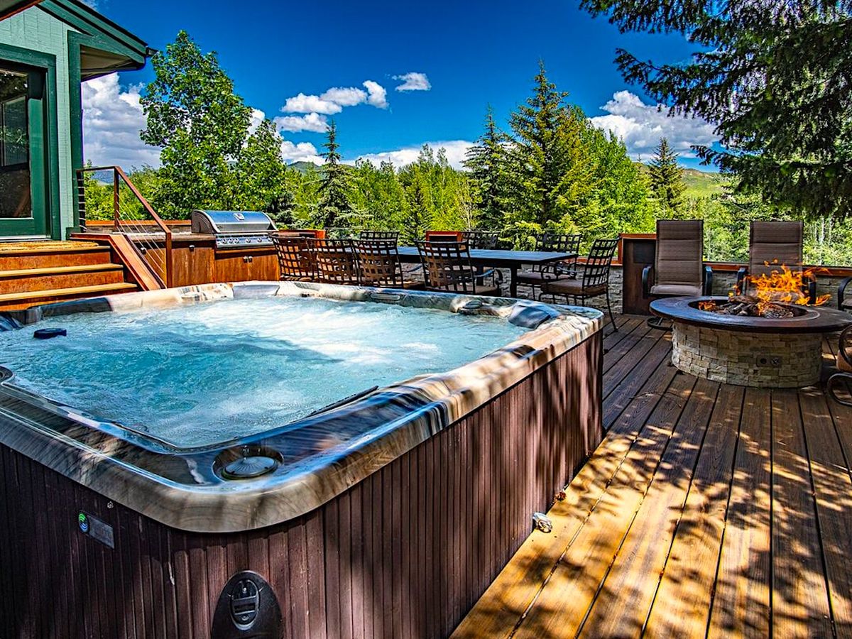 Hot tub, Fire Pit, and Outdoor Seating on Back Deck of Luxury Sun Valley Vacation Rental