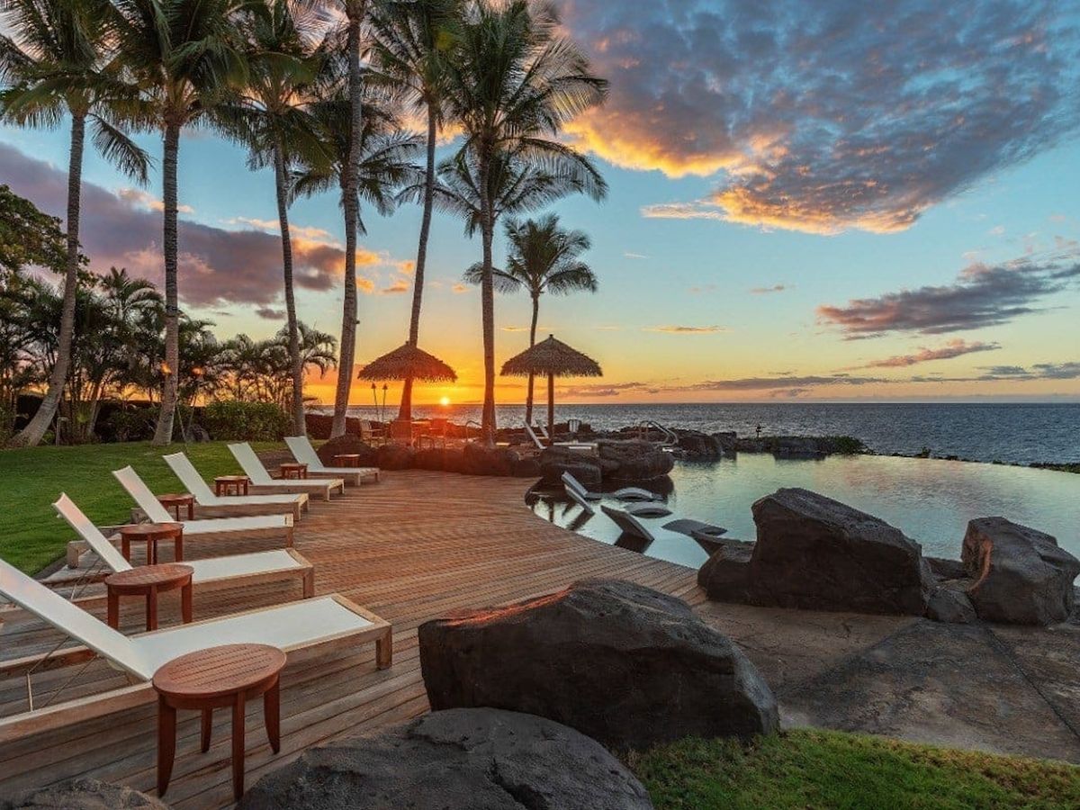Lounge hairs and Private Pool With Ocean Views At A Big Island Luxury Vacation Rental