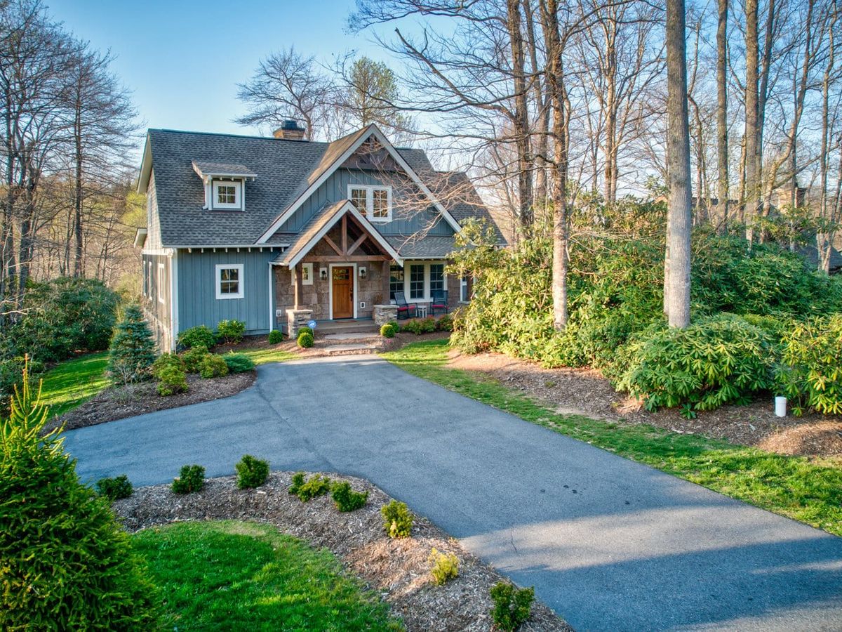 Bluebird Cottage at Sweetgrass is a storybook-style home with a welcoming front porch and manicured landscaping. This cozy retreat is perfect for small families or couples seeking peace in the mountains.